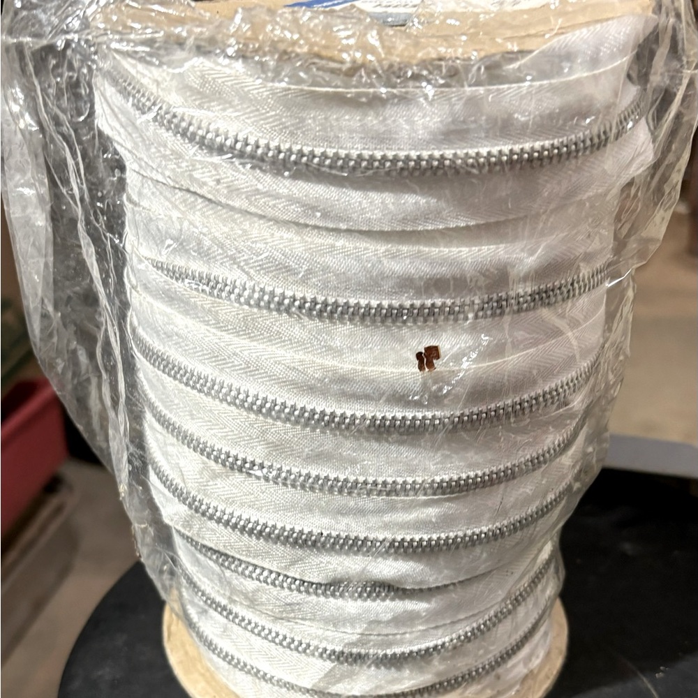 100 yards of #5 aluminum zipper on a roll